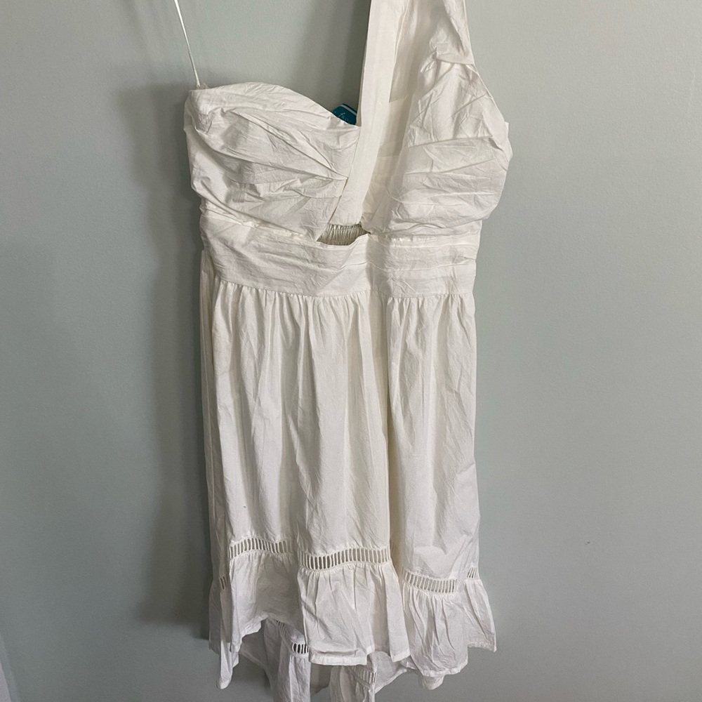 Southern Frock Boutique white hi-low, one shoulder goddess dress with cutouts.